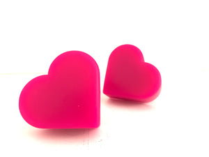 hot pink(magenta) color heart shaped roller skate toe stop on a white background