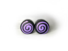 Load image into Gallery viewer, round roller skate toe stop in a black color with a purple swirl through it on a white background.