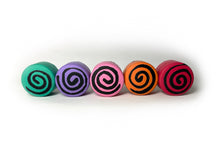 Load image into Gallery viewer, group photo of round shape toe stops. all toe stops pictured are in different colors. far left color is teal with a black swirl through it. left middle is purple with a black swirl through it. center color is pink black swirl through it. right middle is a orange color with a black swirl through it. far right is an orange color with a black swirl through it. all on a white background. 