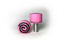Load image into Gallery viewer, pink color round roller skate toe stop with a black swirl through it on a white background. 