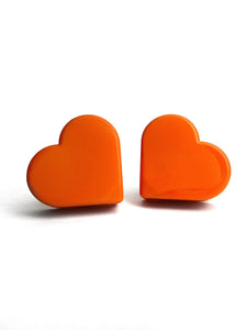 orange color heart shaped roller skate toe stop on a white background