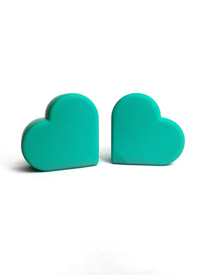 teal(turquoise) color heart shaped roller skate toe stop on a white background