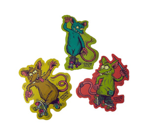 three stickers shown on a white background. one sticker is a brown rat with his tongue sticking out to the side  wearing blue roller skates with a pink heart shaped toe stop and lime green wheels  on a yellow background. one sticker is a green rat, holding a dagger, wearing purple roller skates with a red heart shaped toe stop and lime green wheels on a red background. one sticker is a blue rat wearing green roller skates with a pink heart shaped toe stop and purple wheels on a green background.