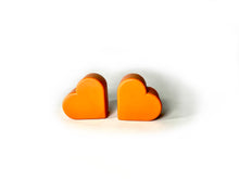 Load image into Gallery viewer, orange color heart shaped roller skate toe stop on a white background