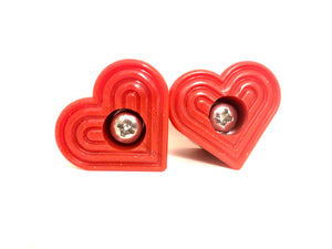 hot rod red bolt-on heart shaped roller skate toe stop on a white background
