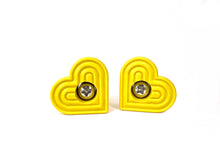 Load image into Gallery viewer, yellow color heart shaped roller skate toe stop with a bolt in the center on a white background